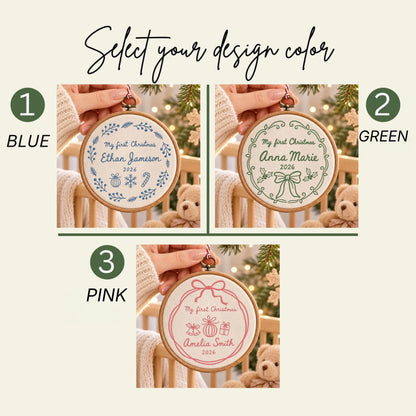 May include: Three circular embroidery hoop ornaments featuring custom text and holiday motifs. Option 1 is blue with Ethan Jameson 2026, option 2 is green with Anna Marie 2026, and option 3 is pink with Amelia Smith 2026. Each displays My first Christmas.