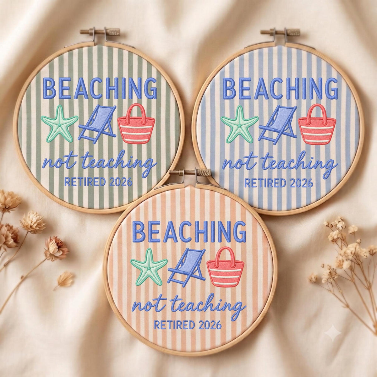May include: Three circular embroidery hoops featuring striped fabric in sage green, light blue, and peach. Each hoop displays embroidered text reading BEACHING not teaching RETIRED 2026, accompanied by a light green starfish, a blue beach chair, and a red tote bag.