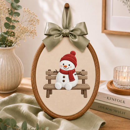 Embroidered Snowman Sitting on Wooden Bench Oval Hoop Decor, Cozy Winter Christmas Wall Hanging Sign, Cute Holiday Nursery Gift