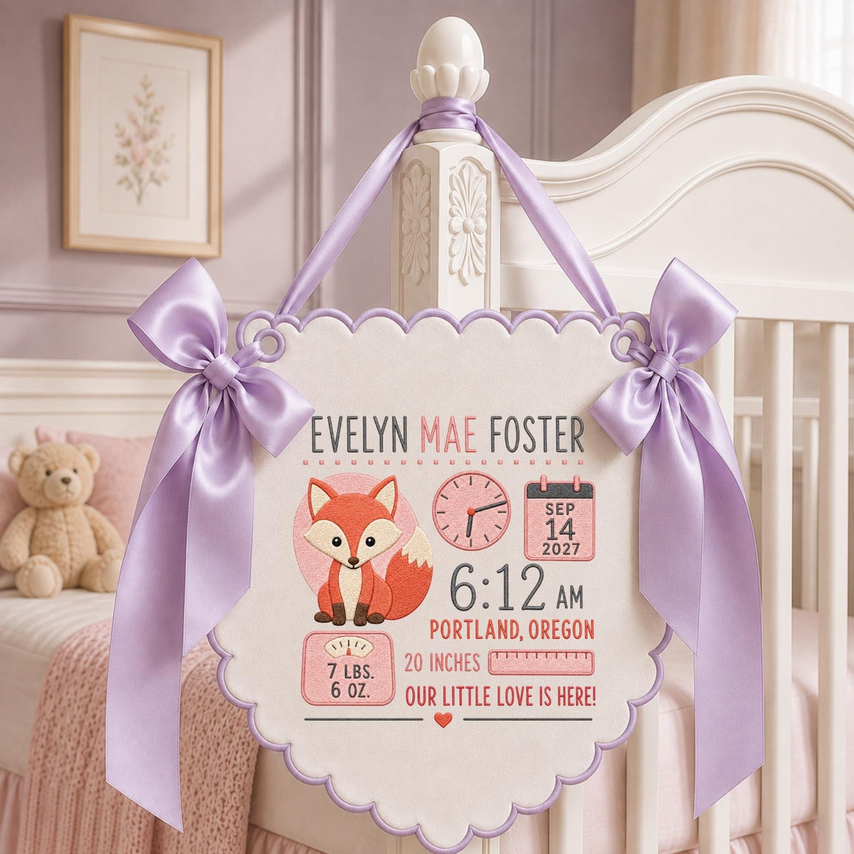 May include: A white scalloped wall hanging featuring a fox illustration, the name Evelyn Mae Foster, a clock showing 6:12, a calendar date of Sep 14 2027, Portland Oregon, 7 lbs 6 oz, 20 inches, and the text Our Little Love Is Here, with lavender ribbons.
