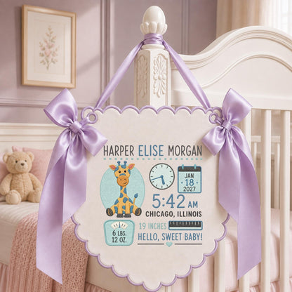 May include: A white scalloped wall hanging featuring a cartoon giraffe, a clock showing 5:42 AM, a calendar for Jan 18, 2027, and text reading Harper Elise Morgan, 6 lbs. 12 oz., 19 inches, Chicago, Illinois, and Hello, Sweet Baby, with lavender ribbons.