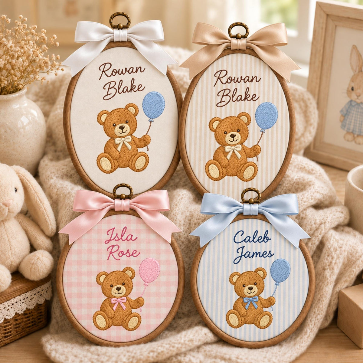 May include: Four oval wooden embroidery hoops featuring embroidered brown teddy bears holding balloons. Two hoops display the name Rowan Blake, one displays Isla Rose, and one displays Caleb James. Each hoop is topped with a satin ribbon bow.