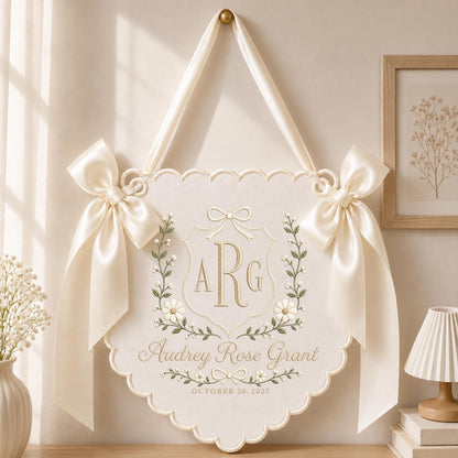 Ivory embroidered floral crest monogram baby banner