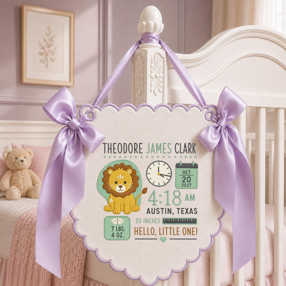 May include: A scalloped white wall hanging featuring the name Theodore James Clark, a lion illustration, a clock showing 4:18 AM, a calendar for Oct 20 2027, Austin Texas, 20 inches, 7 lbs. 4 oz., and Hello, Little One, accented with lavender ribbons.